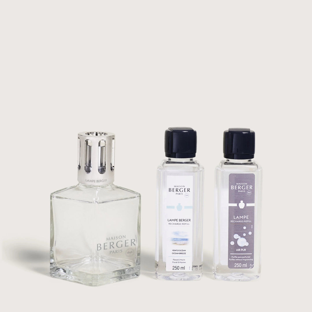 Three bottles of Berger scented products on a light gray background