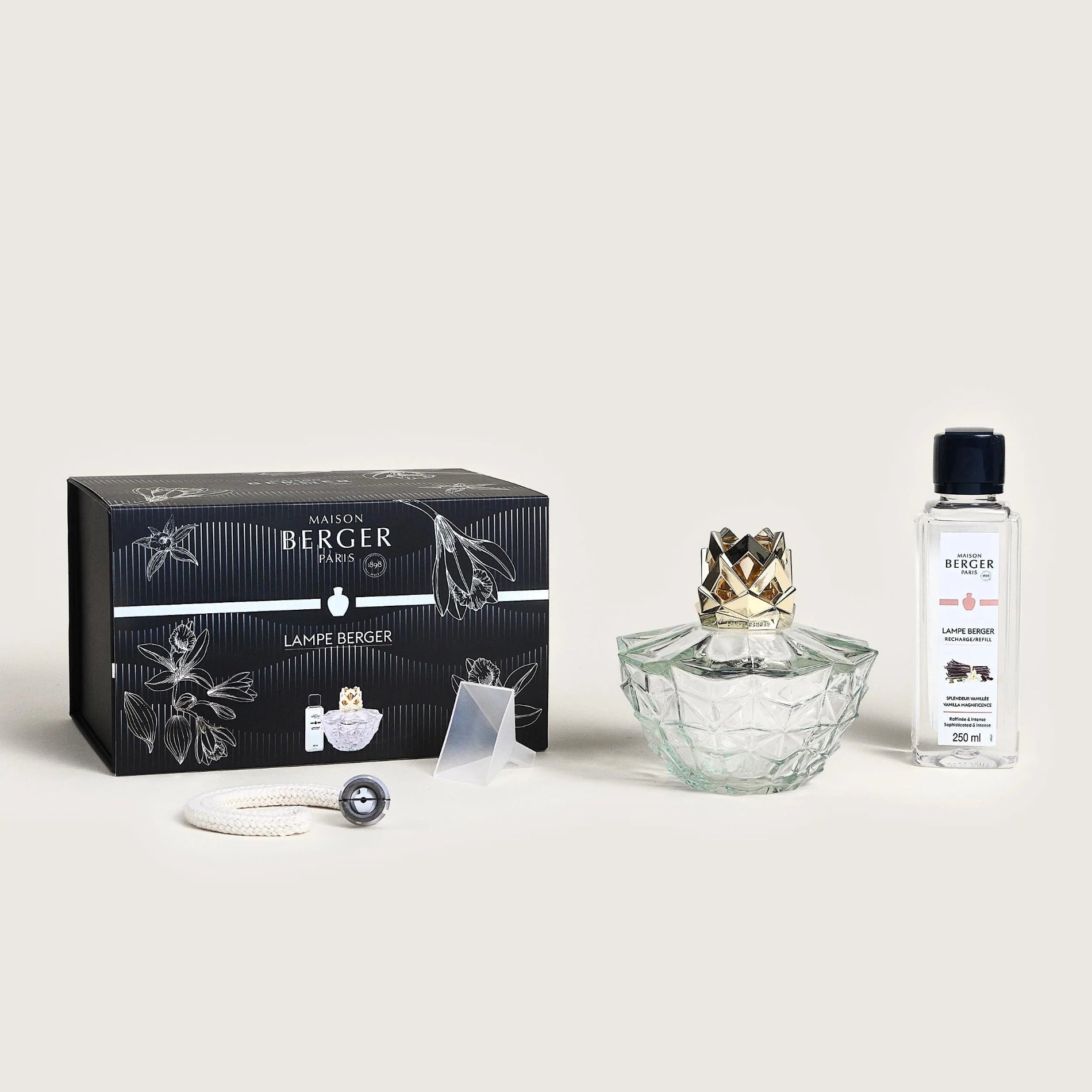 Collection of products from the brand 'Berger' including a crystal diffuser, packaging, and a bottle on a light gray background.