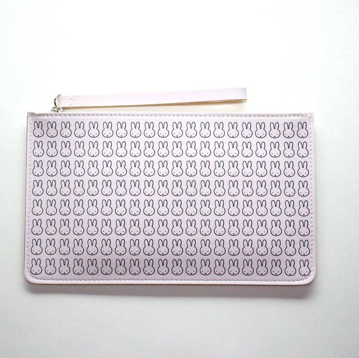 White pouch with bunny pattern on a white background