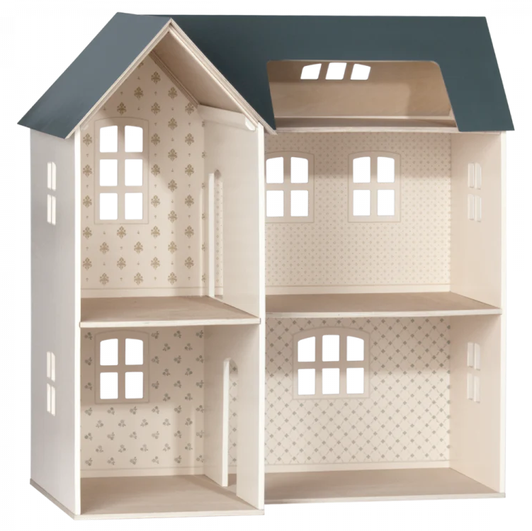 A white Maileg dollhouse with a gray roof, featuring multiple rooms and miniature windows.
