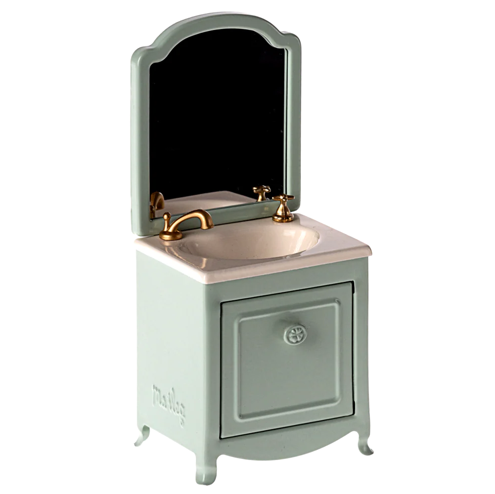 Small bathroom vanity with mirror and sink on a white background