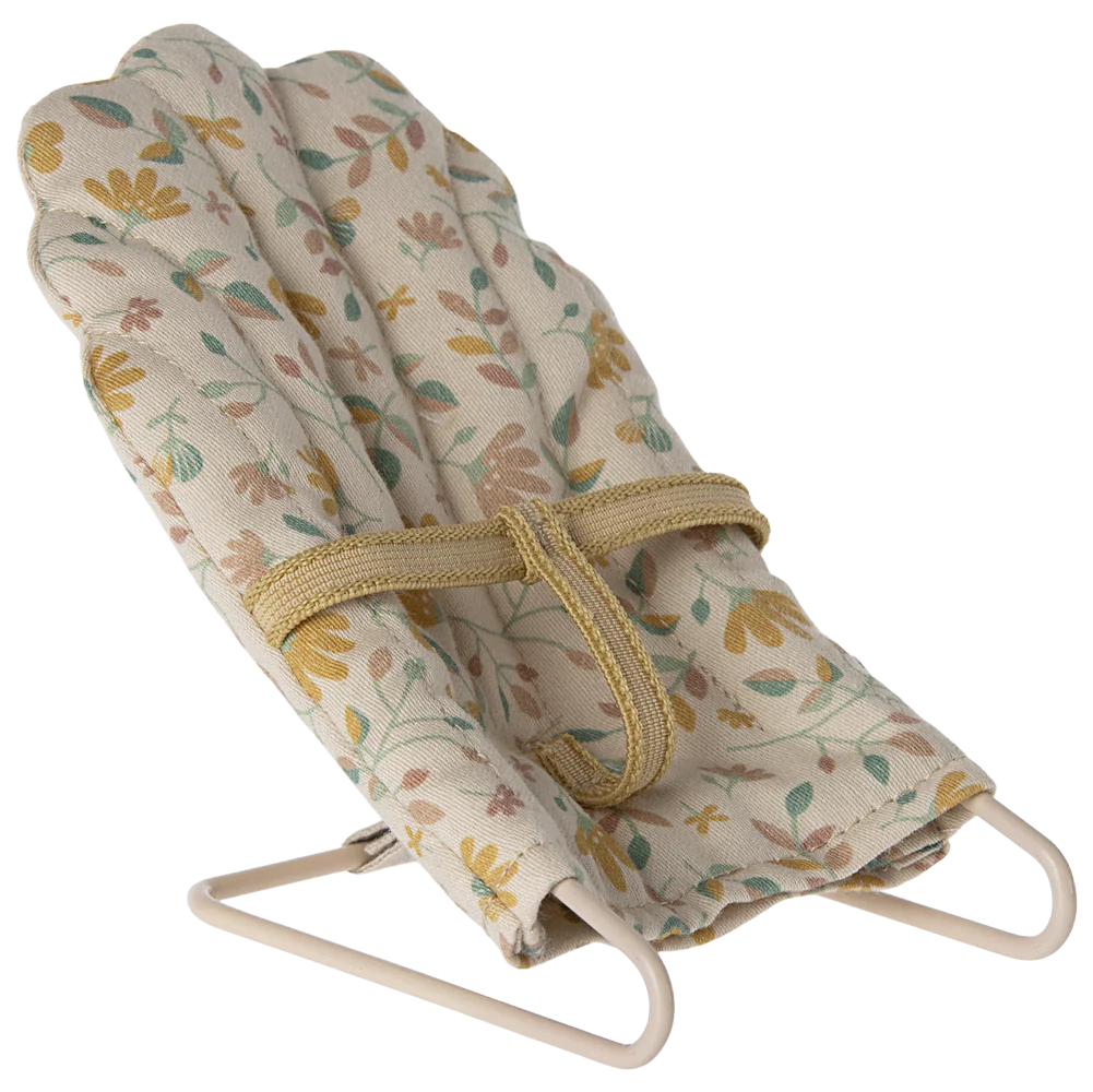 A micro baby sitter toy with a metal base and floral fabric covering, designed for micro sized rabbits and bunnies.