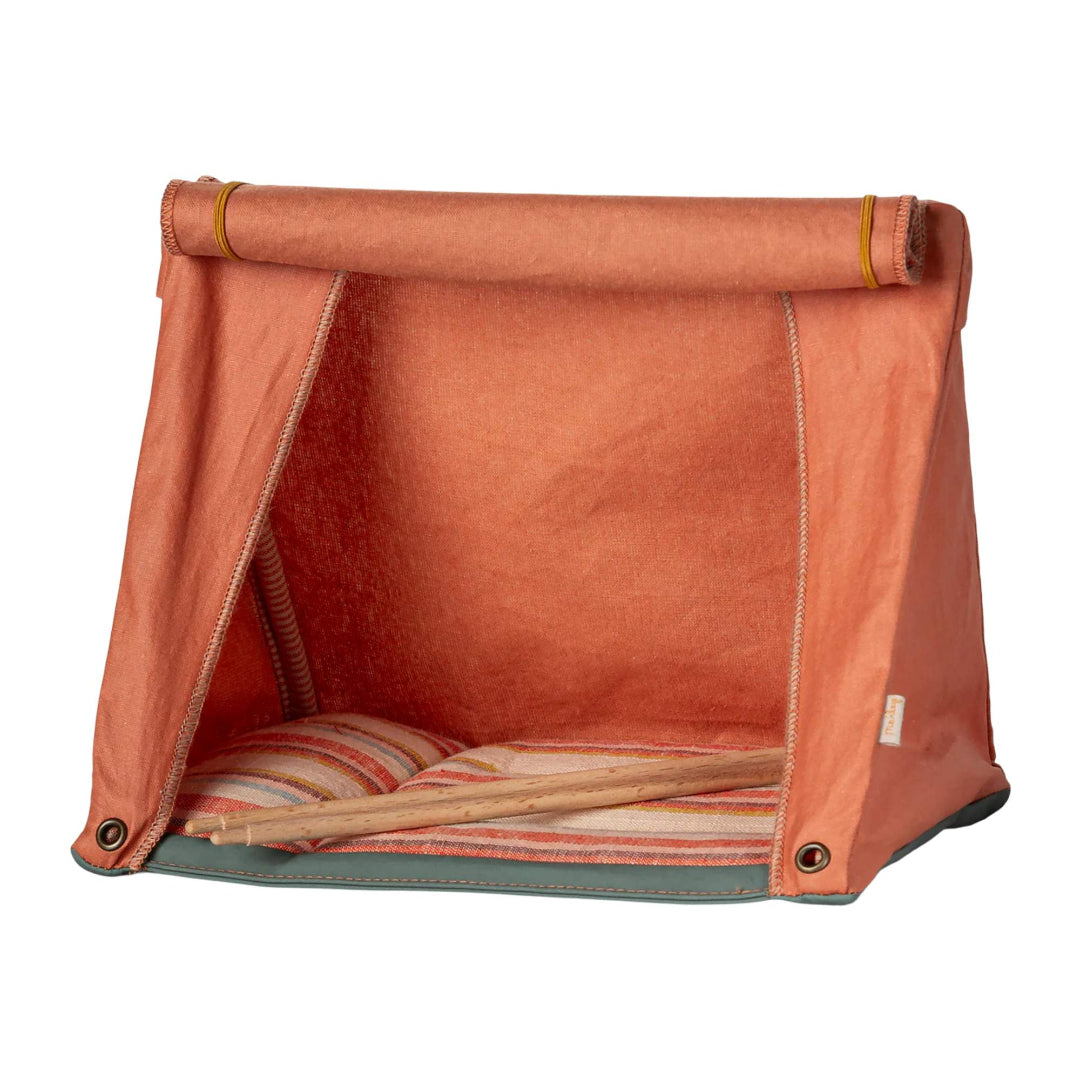 Orange fabric play tent with striped cushion on a white background