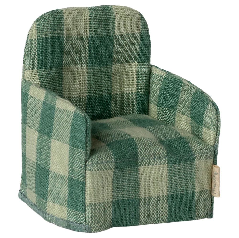 Green checkered armchair on a white background