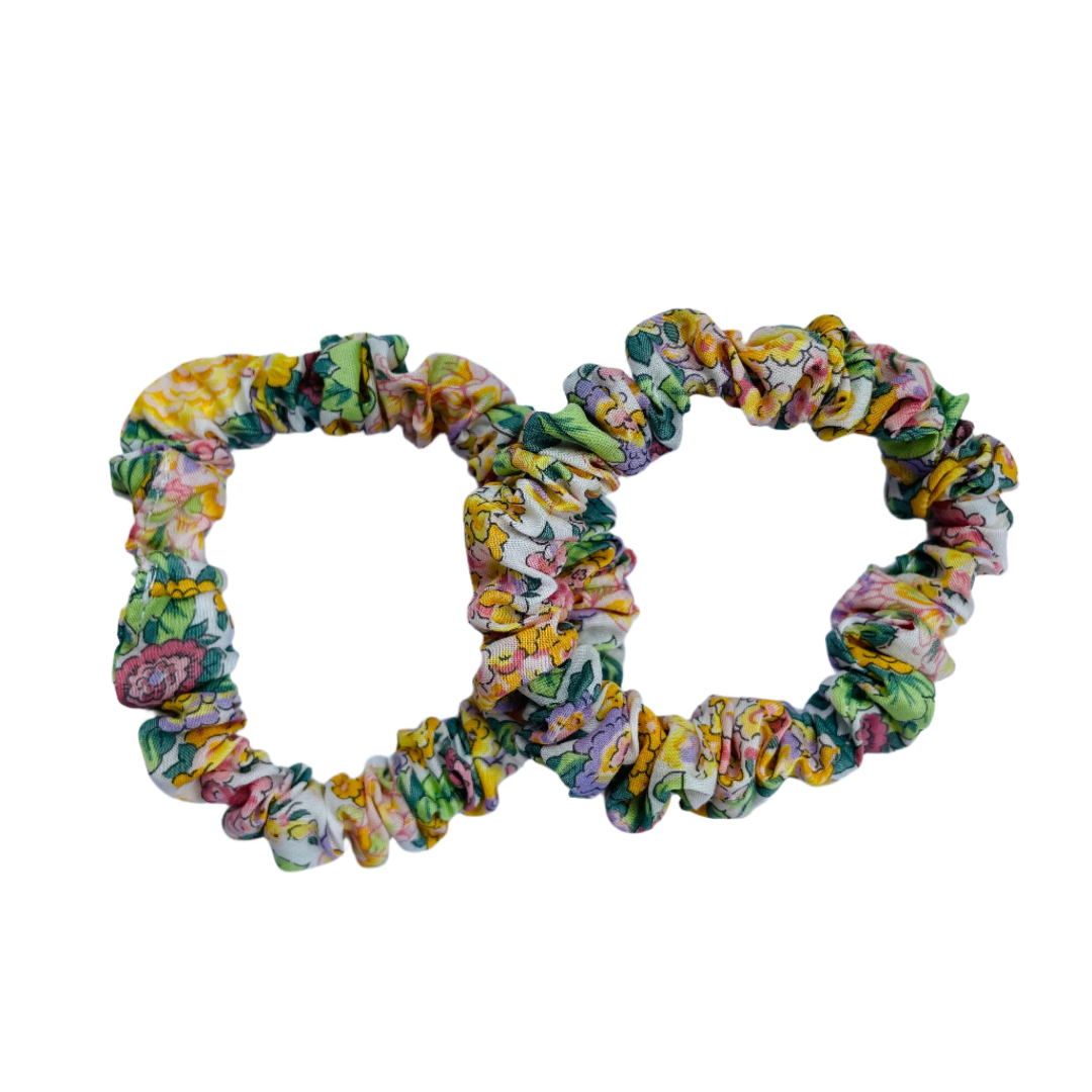 Set of floral scrunchies on a white background