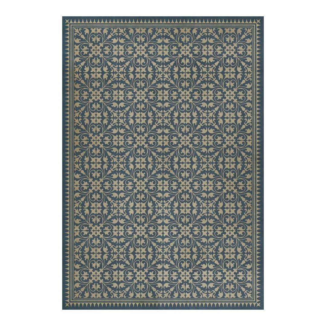 Patterned rug with blue and beige design on a white background