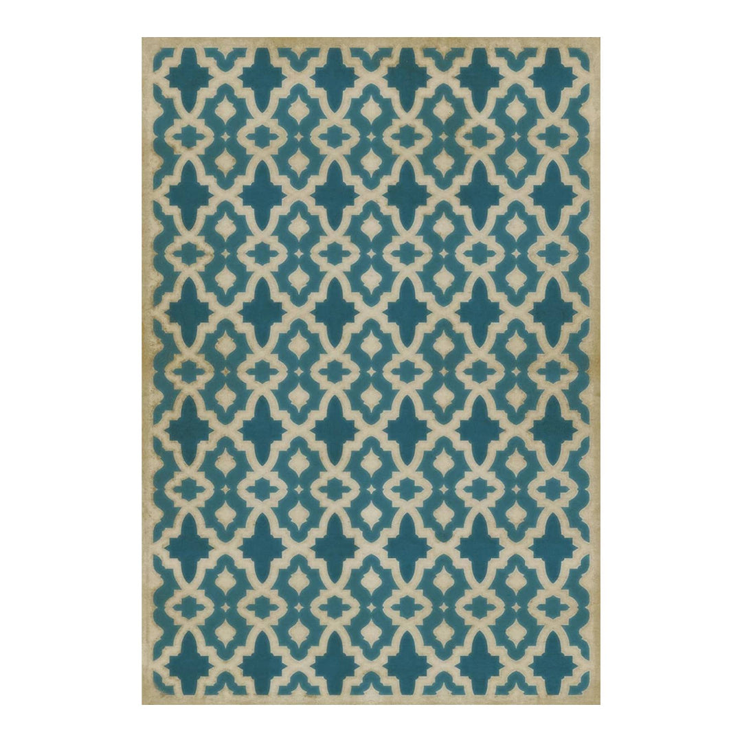 Blue and beige patterned rug on a white background