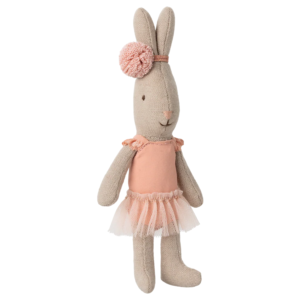Stuffed bunny toy in a beige outfit with a pink bow on a white background