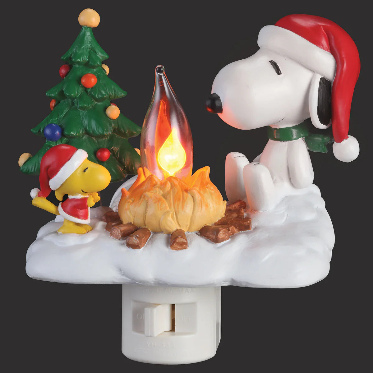 Decorative night light featuring Snoopy and Woodstock by a campfire with a Christmas tree in the background.