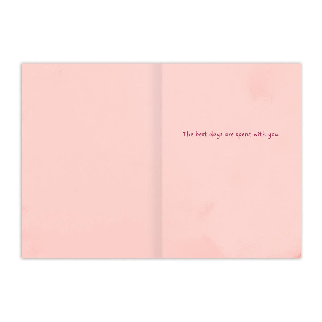 Open card with text 'The best days are spent with you' on a pink background