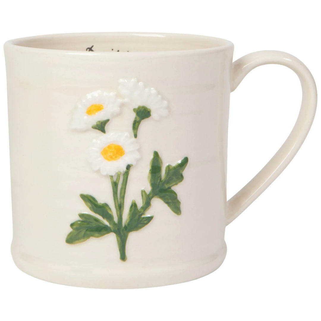 White mug with floral design on a white background