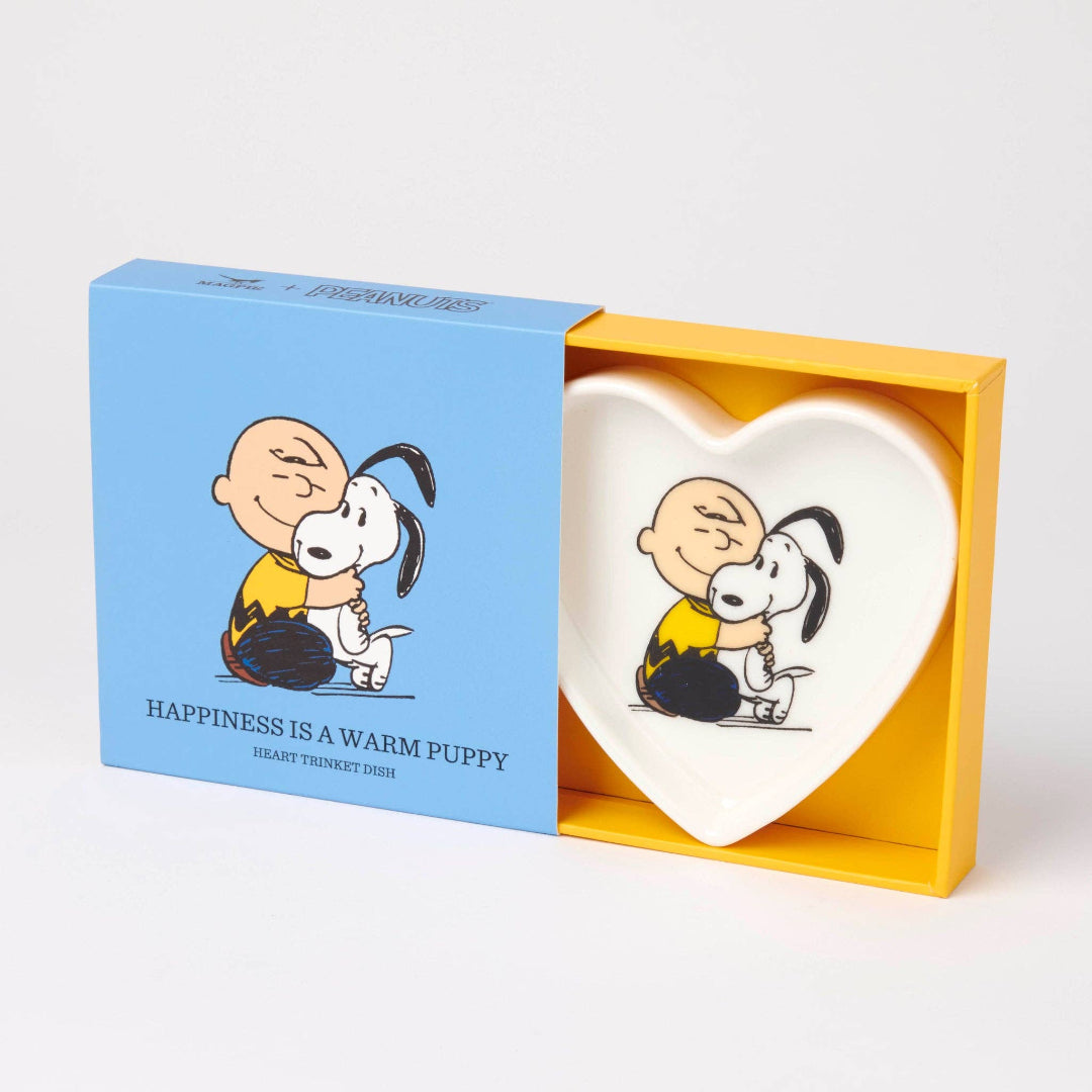 Heart-shaped dish with Charlie Brown and Snoopy design in a yellow box with blue lid.