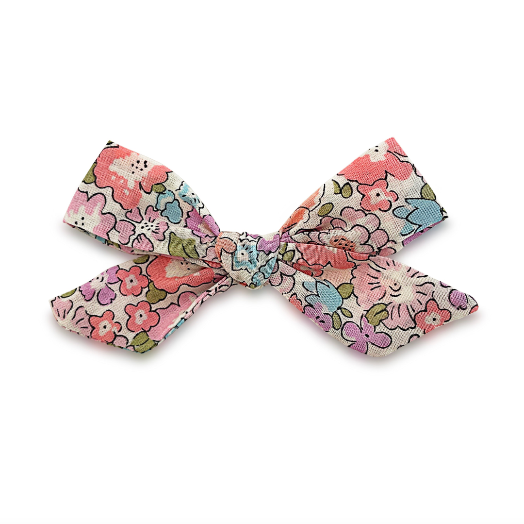 Floral patterned bow on a white background