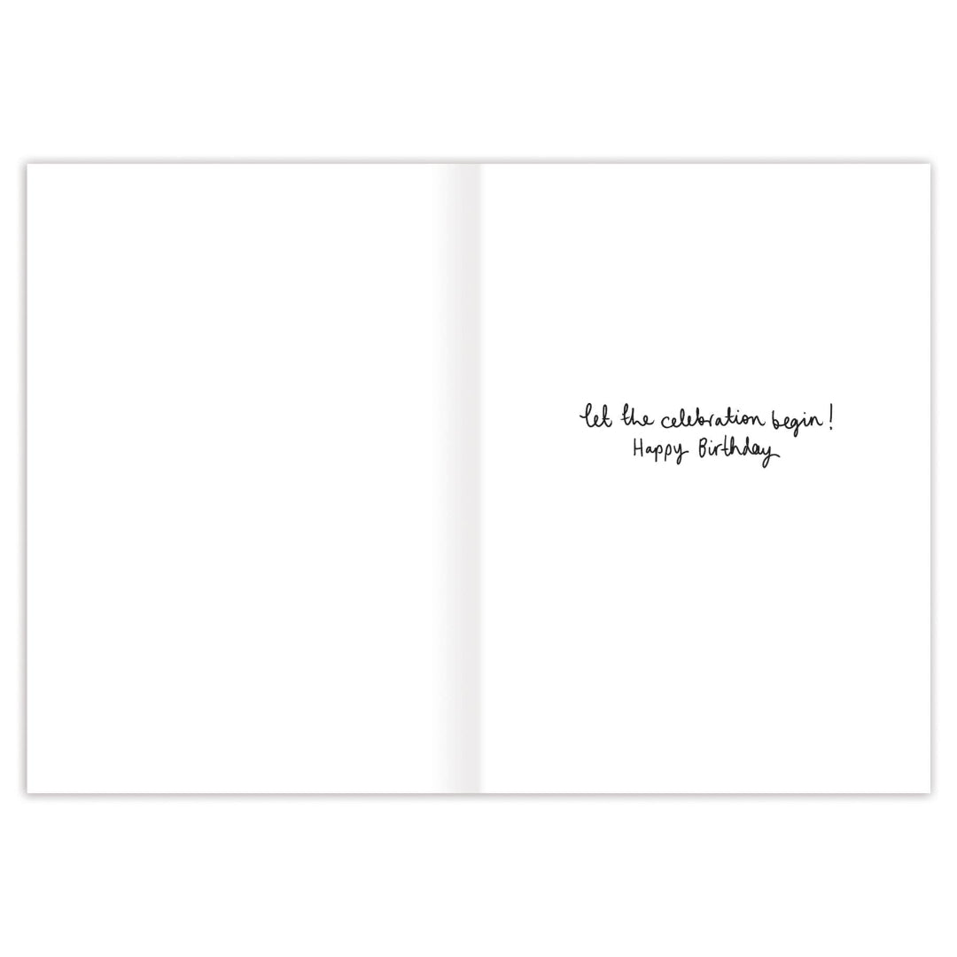 White card with black text 'Let the celebration begin! Happy Birthday' on a white background
