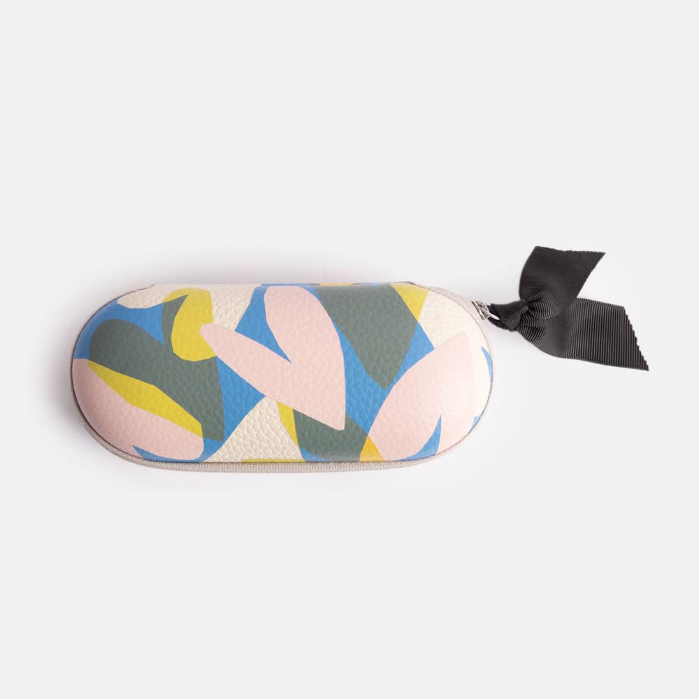 Colorful abstract heart patterned glasses case with a black ribbon on a white background