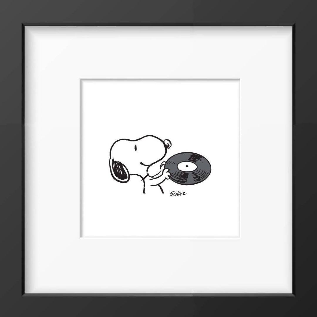 Framed black and white illustration of a Snoopy with a vinyl record.