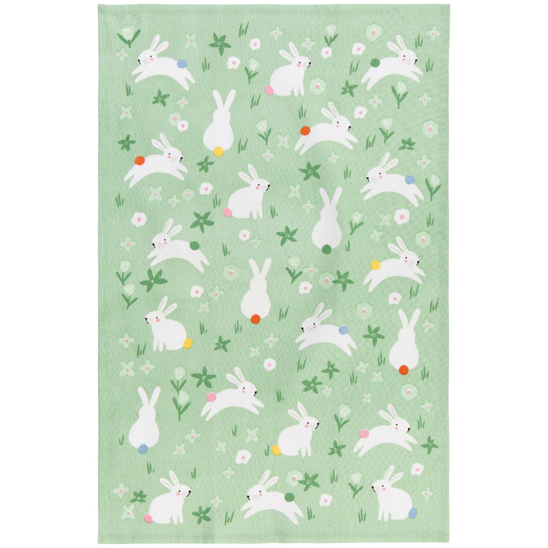 Tea towel with white rabbit pattern on a light green background