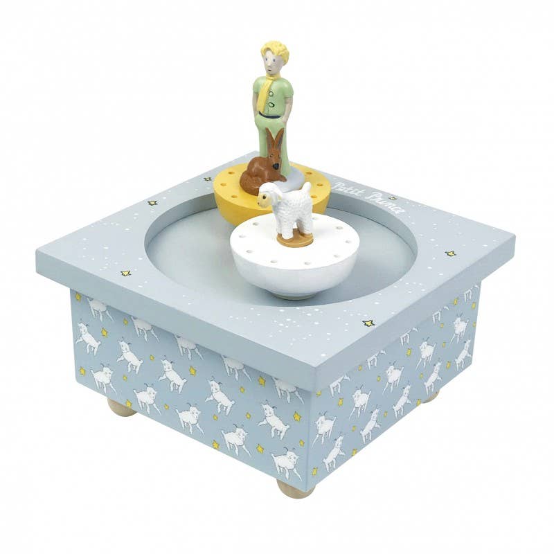 Decorative music box with figurines on a white background