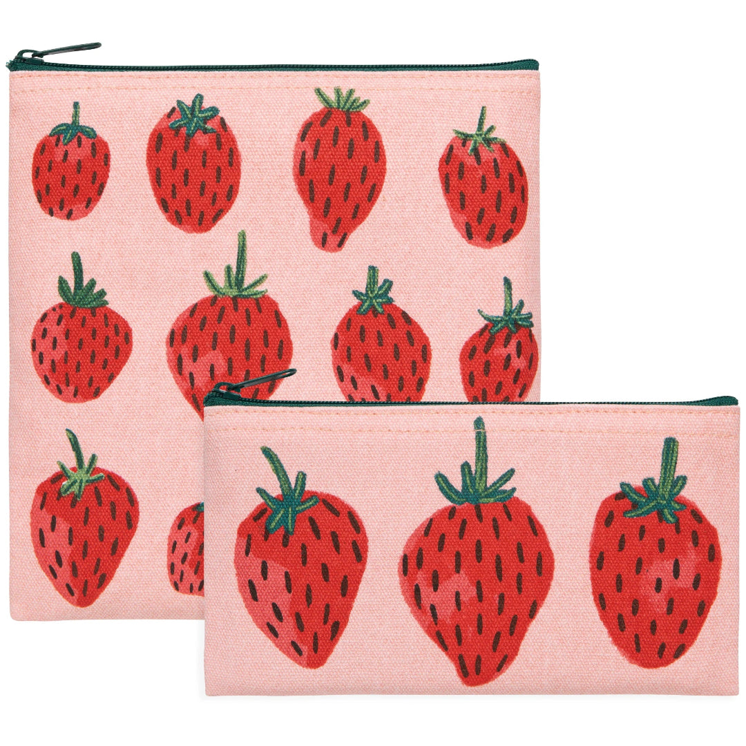 Two pink pouches with red strawberry pattern on a white background