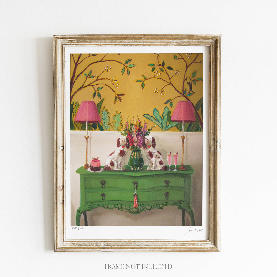 A framed art print featuring a green antique-style dresser with pink lamps and a floral pattern, set against a yellow background. The artwork does not include a frame.