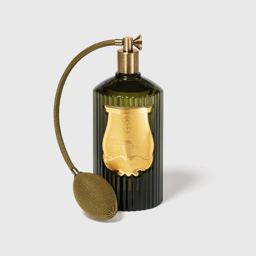 Decorative bottle with gold accents on a light background