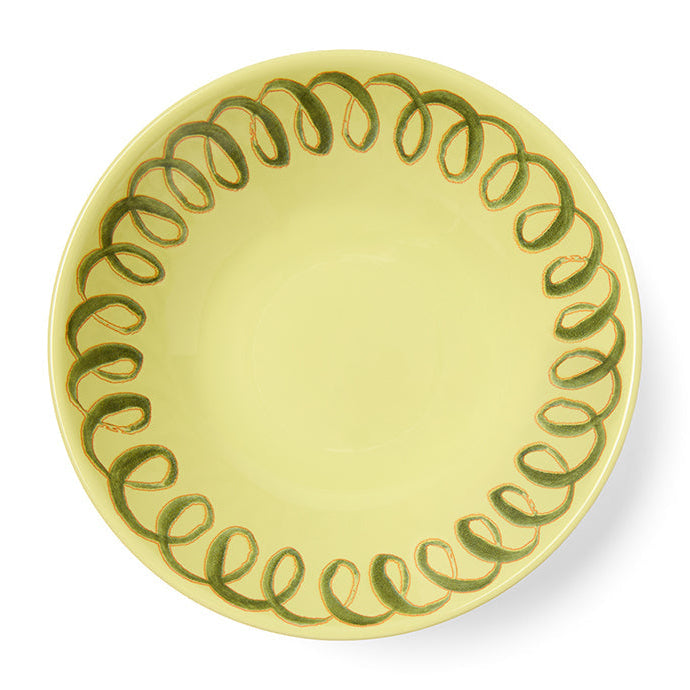 Yellow plate with green decorative border on a white background