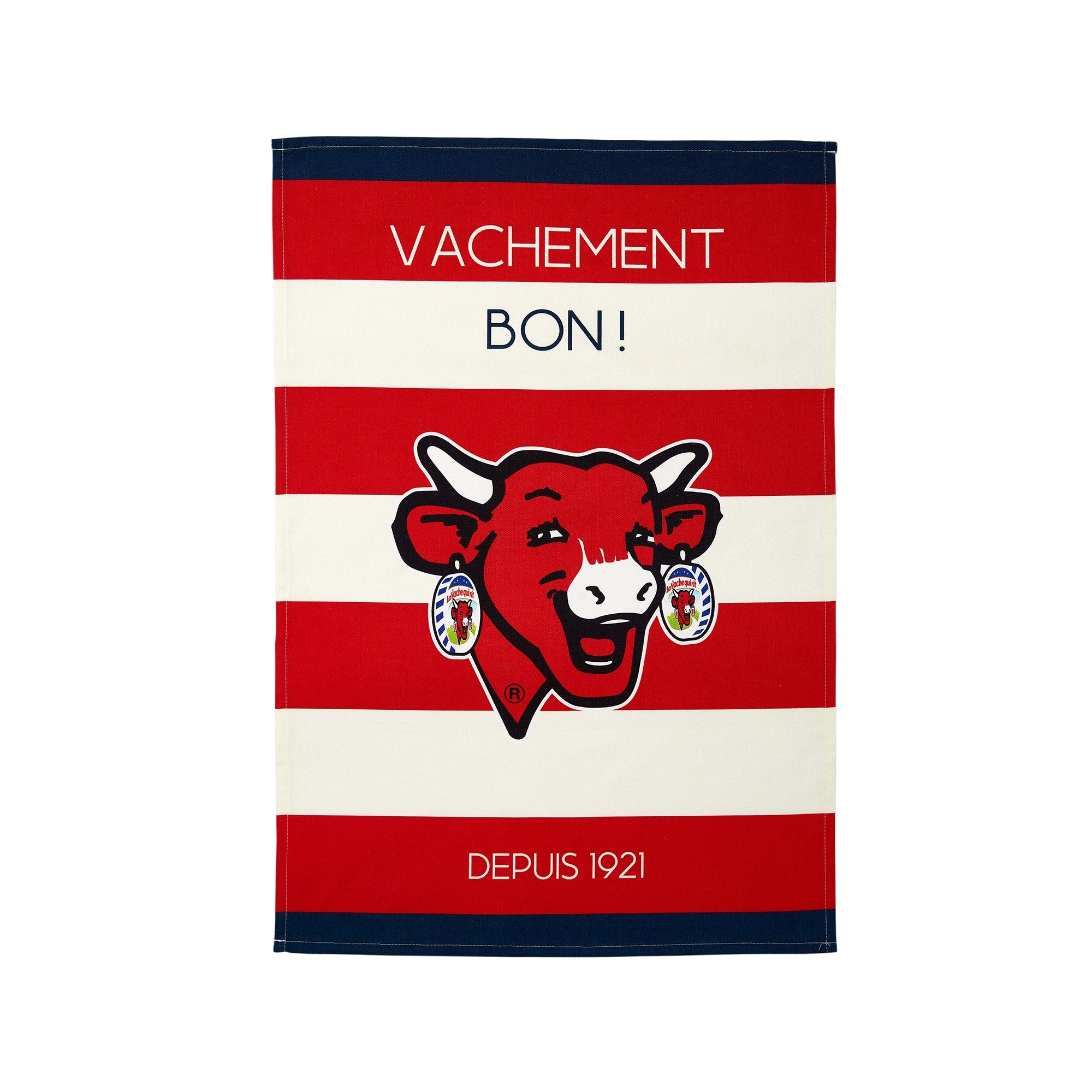 A red and white striped cotton tea towel with a graphic of a smiling cow's head and the text 'VACHEMENT BON! DEPUIS 1921'.