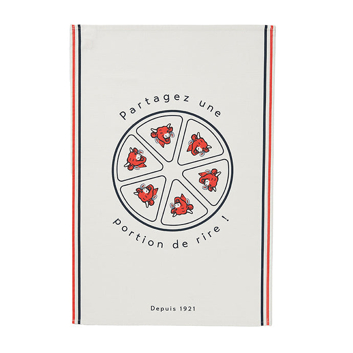 White cotton tea towel with a circular graphic containing smaller images of a cow's face and text reading 'Partagez une portion de rire!' with a red and black striped border at the top.