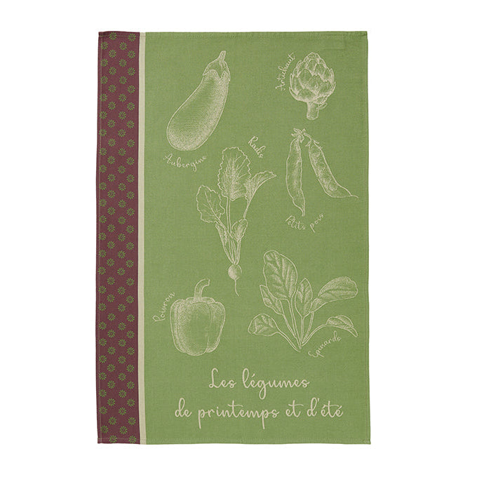 A green cotton tea towel with illustrations of vegetables and the text 'Les legumes de printemps et dét' printed on it.