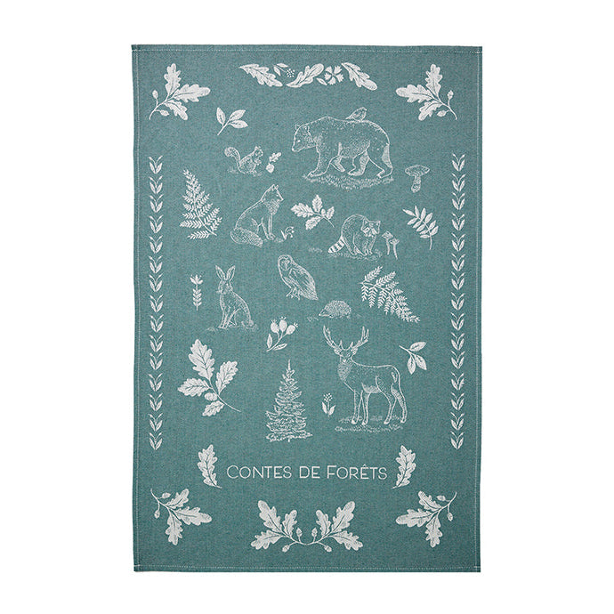Teal towel with white forest animal and plant pattern on a white background