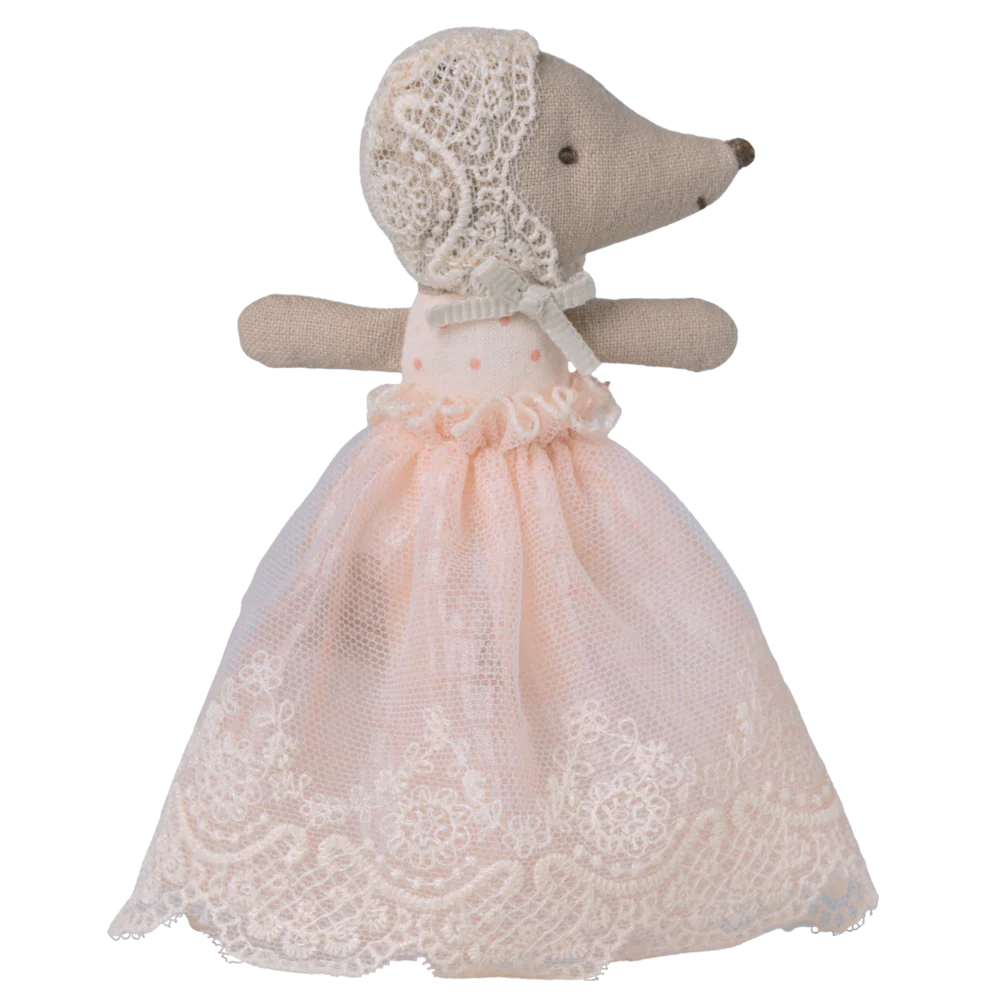 Toy mouse in a lace dress and bonnet on a white background