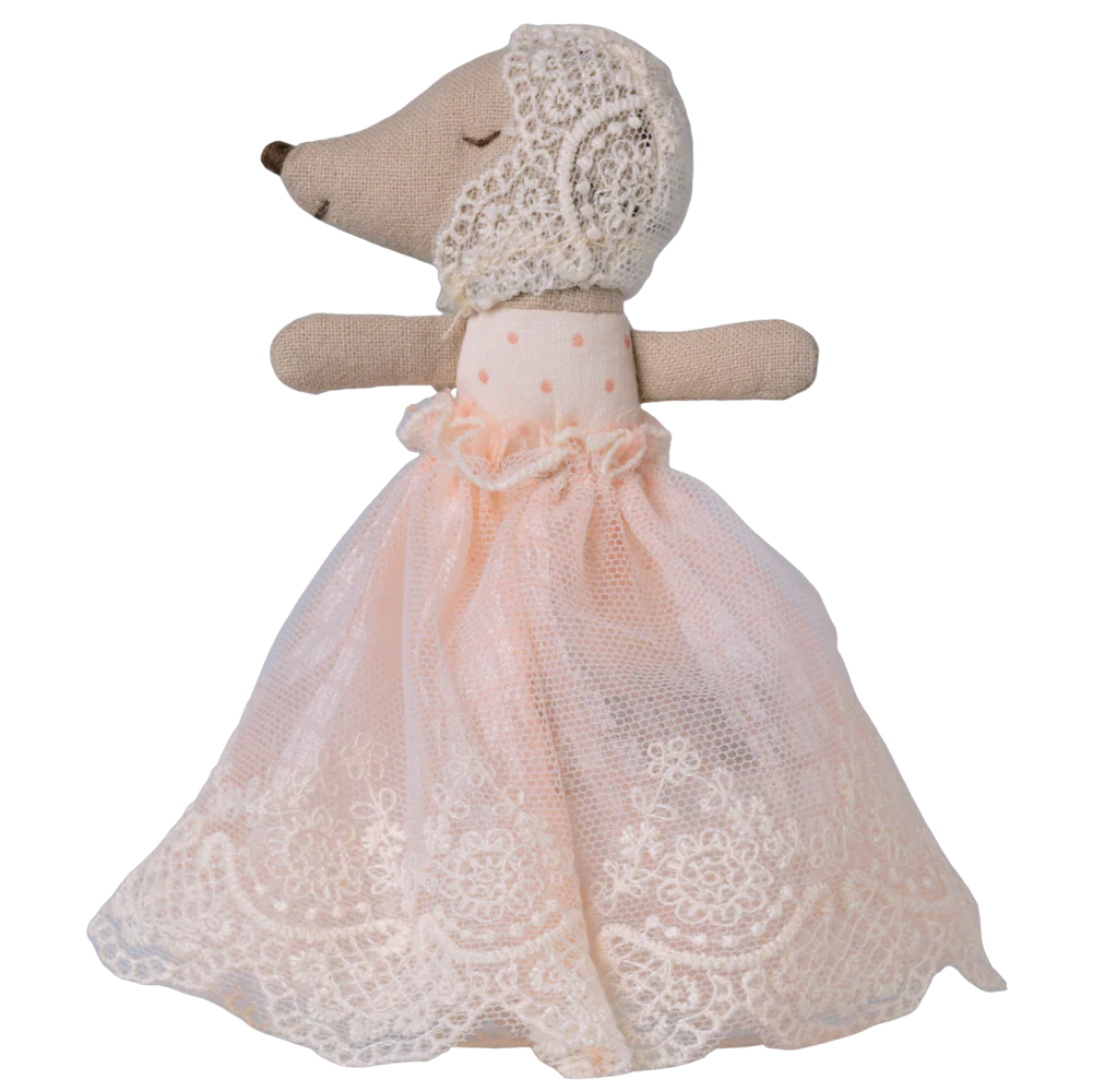Stuffed animal toy with a lace dress on a white background