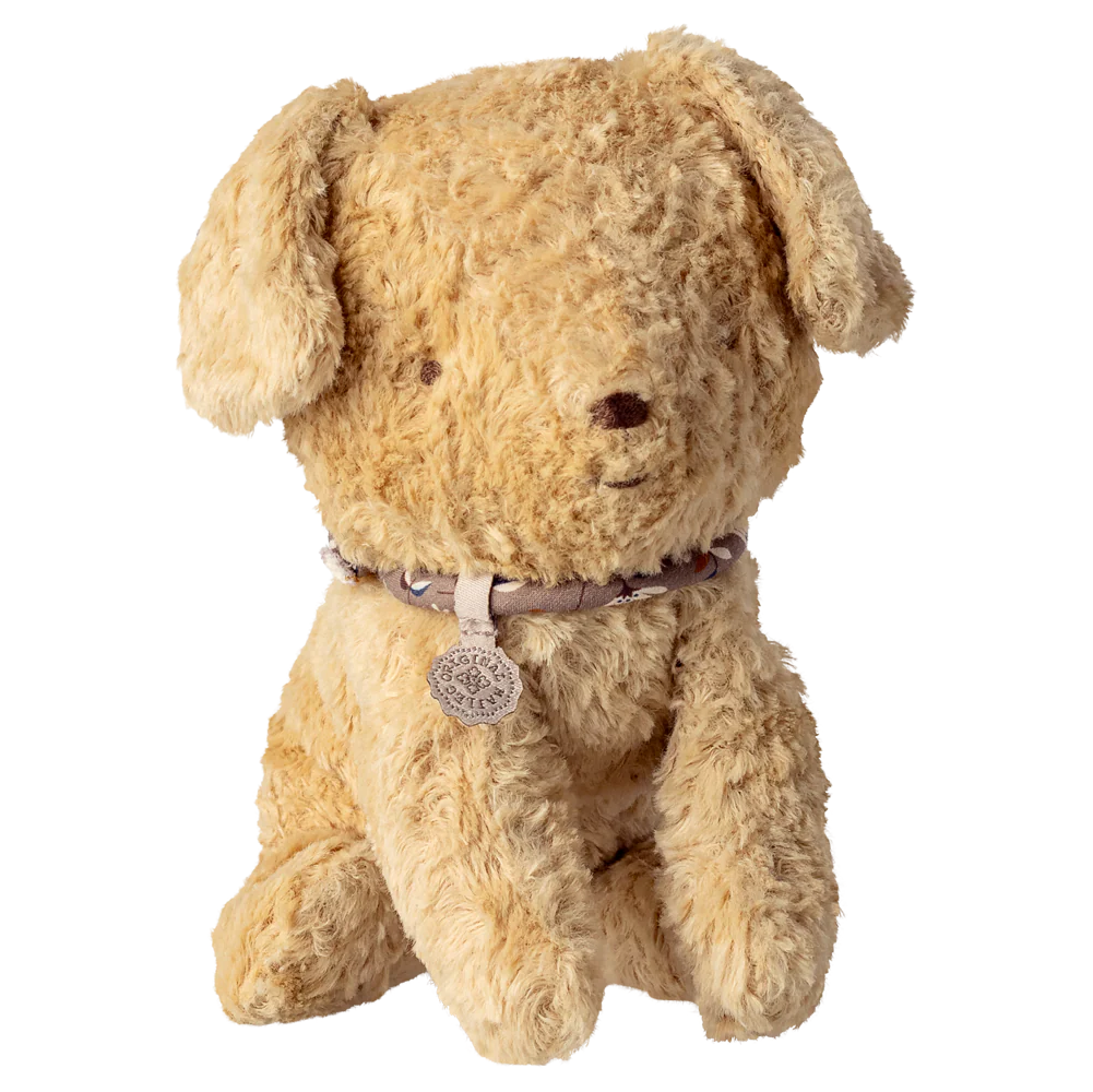 Beige stuffed dog toy with a collar on a white background