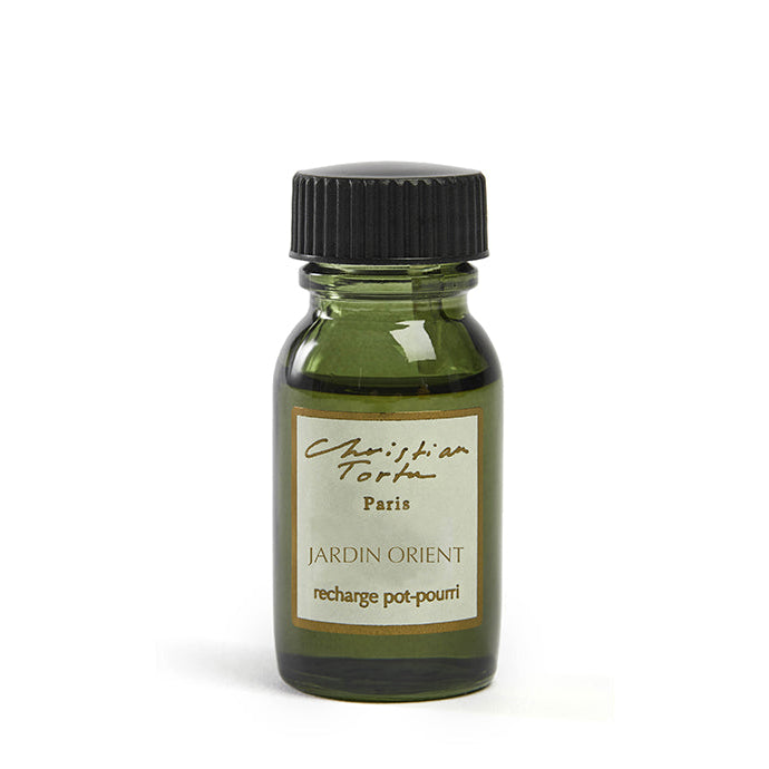 A 15mL bottle of Christian Tortu Jardin Orient potpourri refresher oil with a label that includes the brand name and the scent note 'Geranium Myrrh'. The bottle is sealed with a black cap and has a white background.