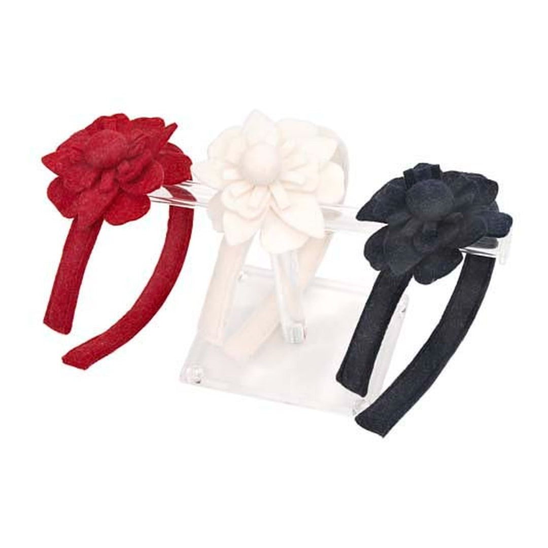 Three headbands with floral designs in red, white, and black on a white background