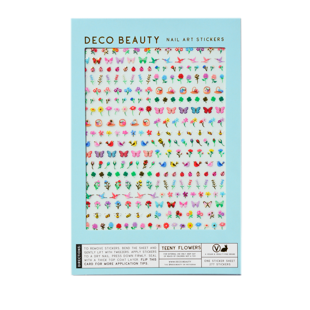 Packaging of Deco Beauty nail art stickers with a variety of colorful designs on a light blue background.