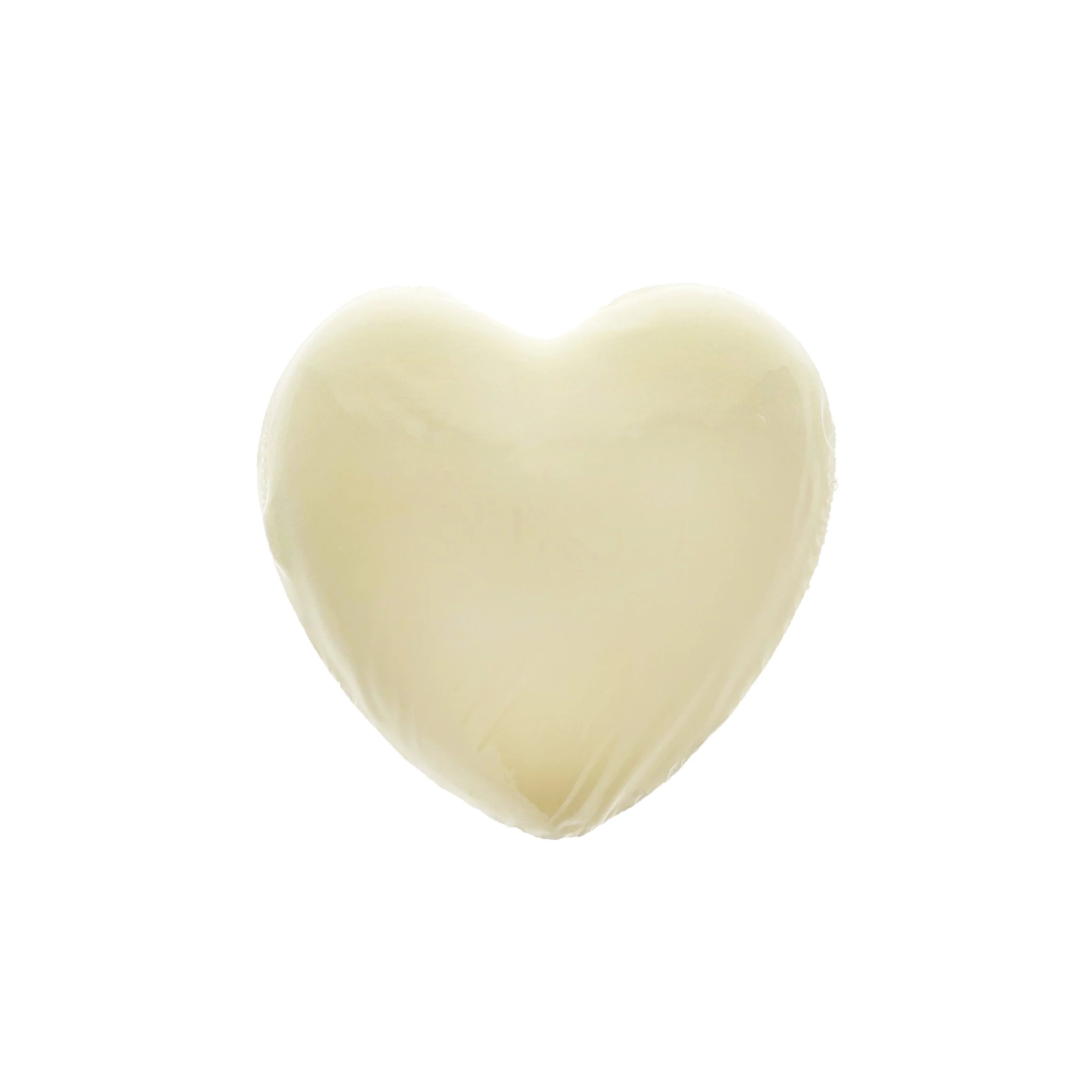 A heart-shaped, solid white soap against a white background