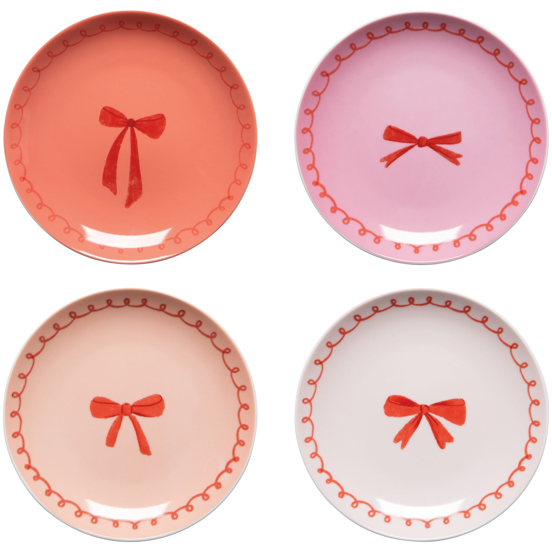 Four decorative plates with red bows on a white background