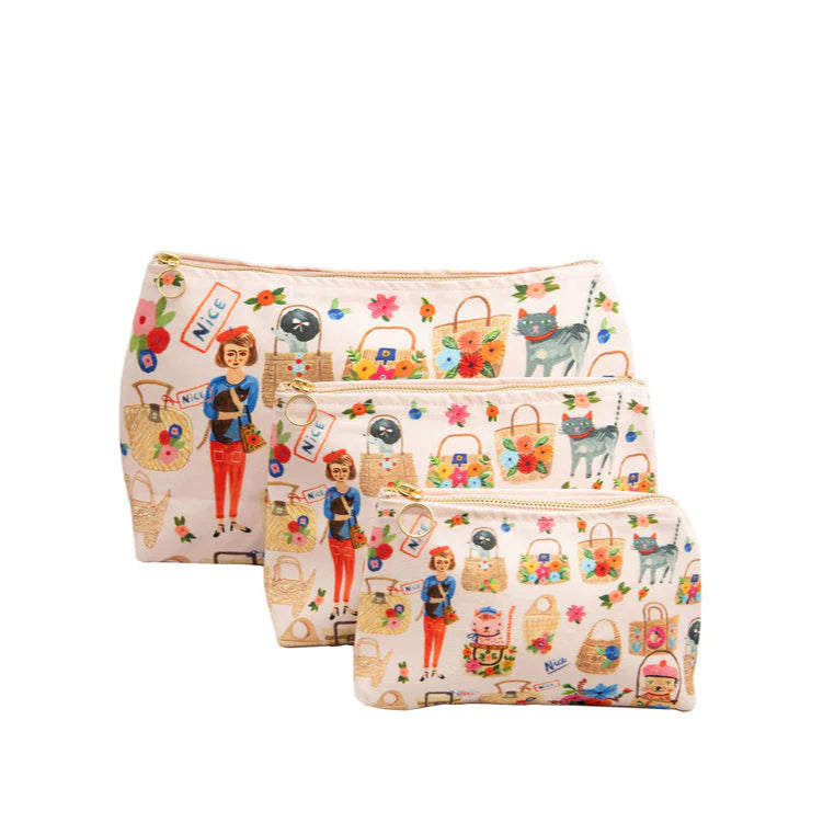 A set of three cosmetic bags with a floral and cat-themed design, displayed against a white background.