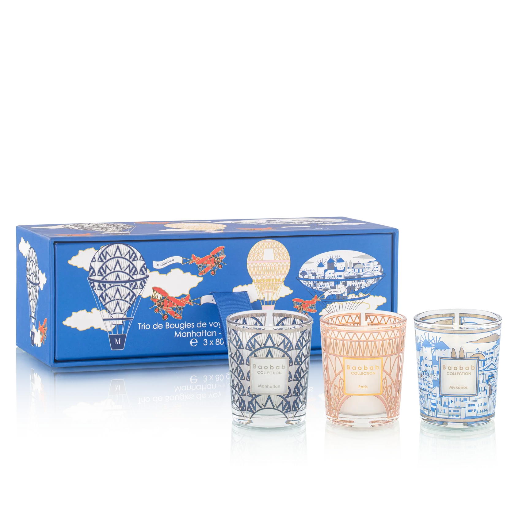 Set of three candles in decorative glass containers with a blue box featuring illustrations on a white background.