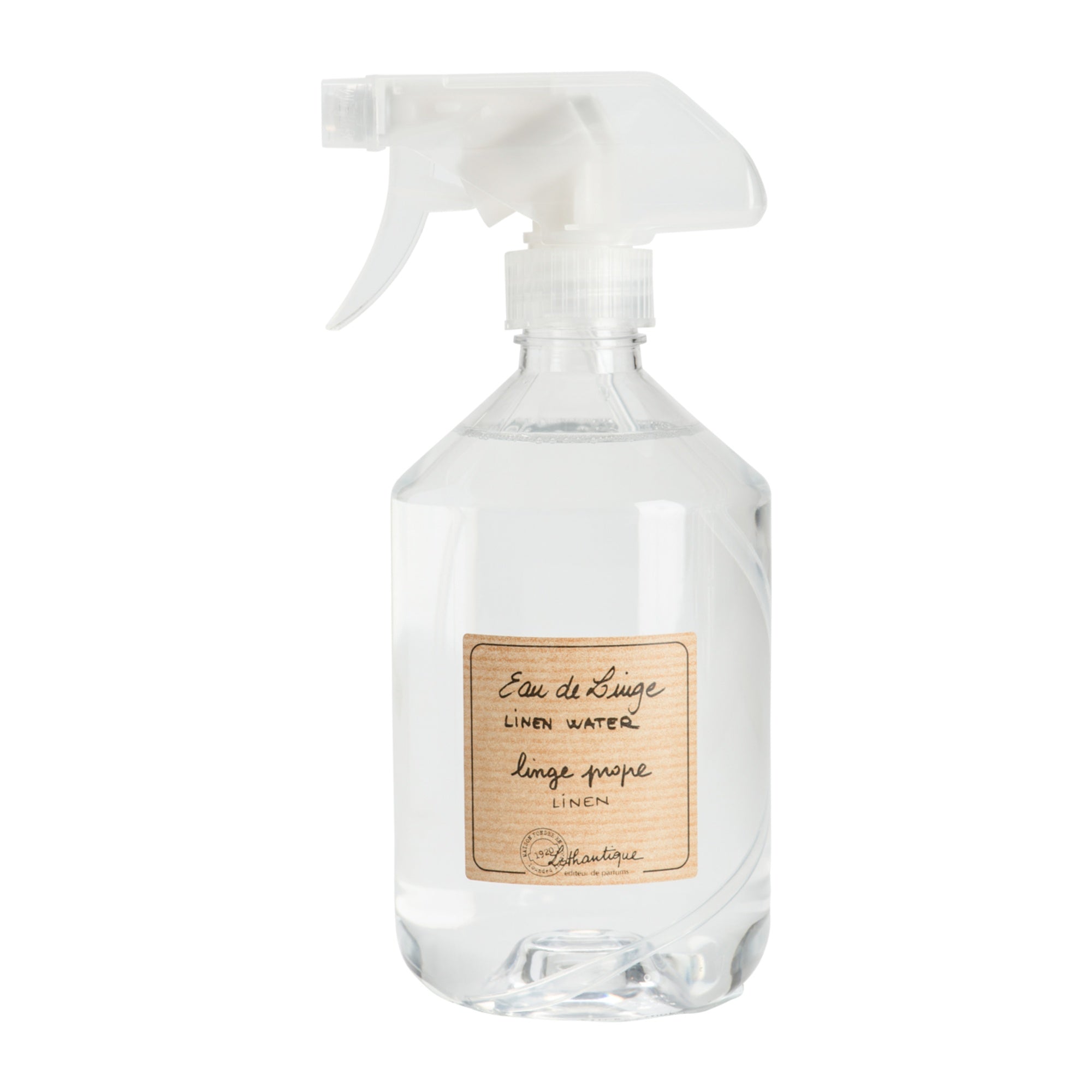 Clear spray bottle with wooden label on a white background