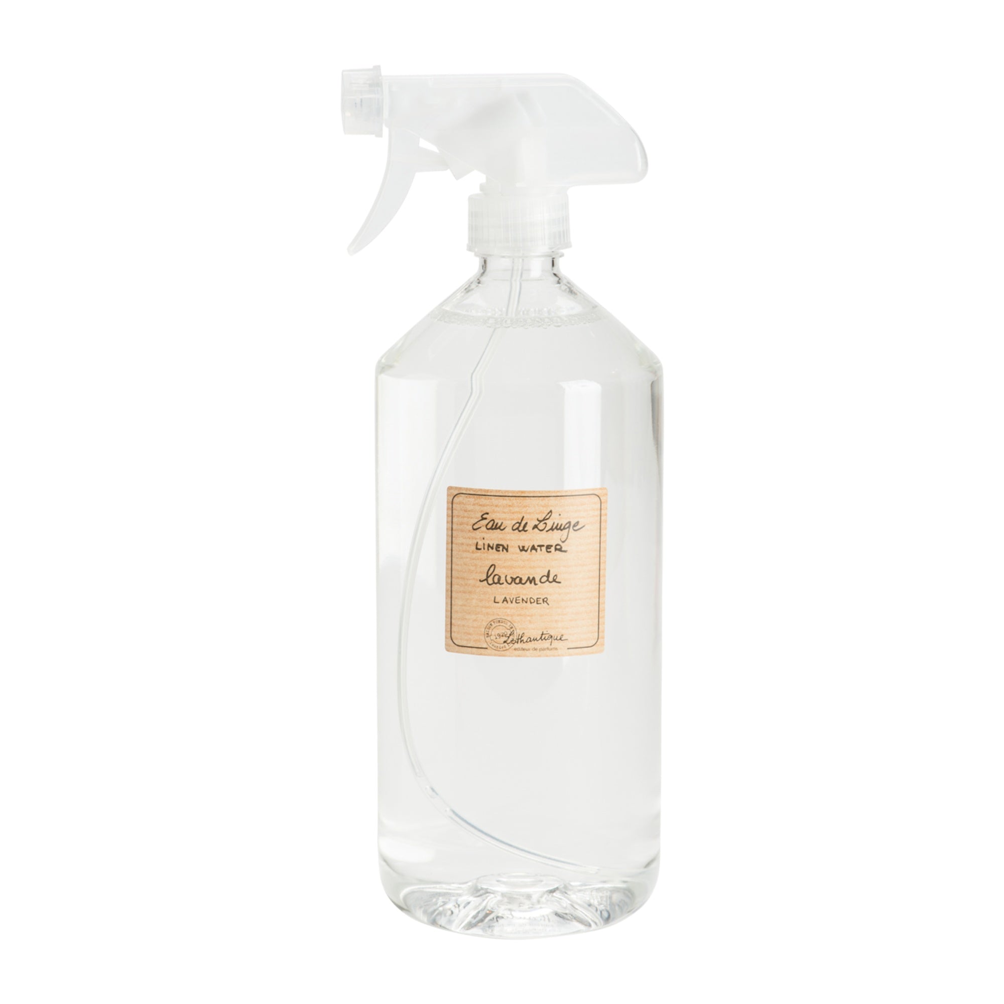 Clear spray bottle with a label on a white background