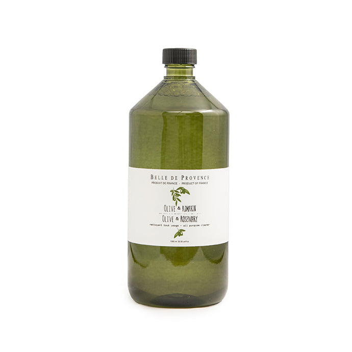 Green bottle with a label on a white background