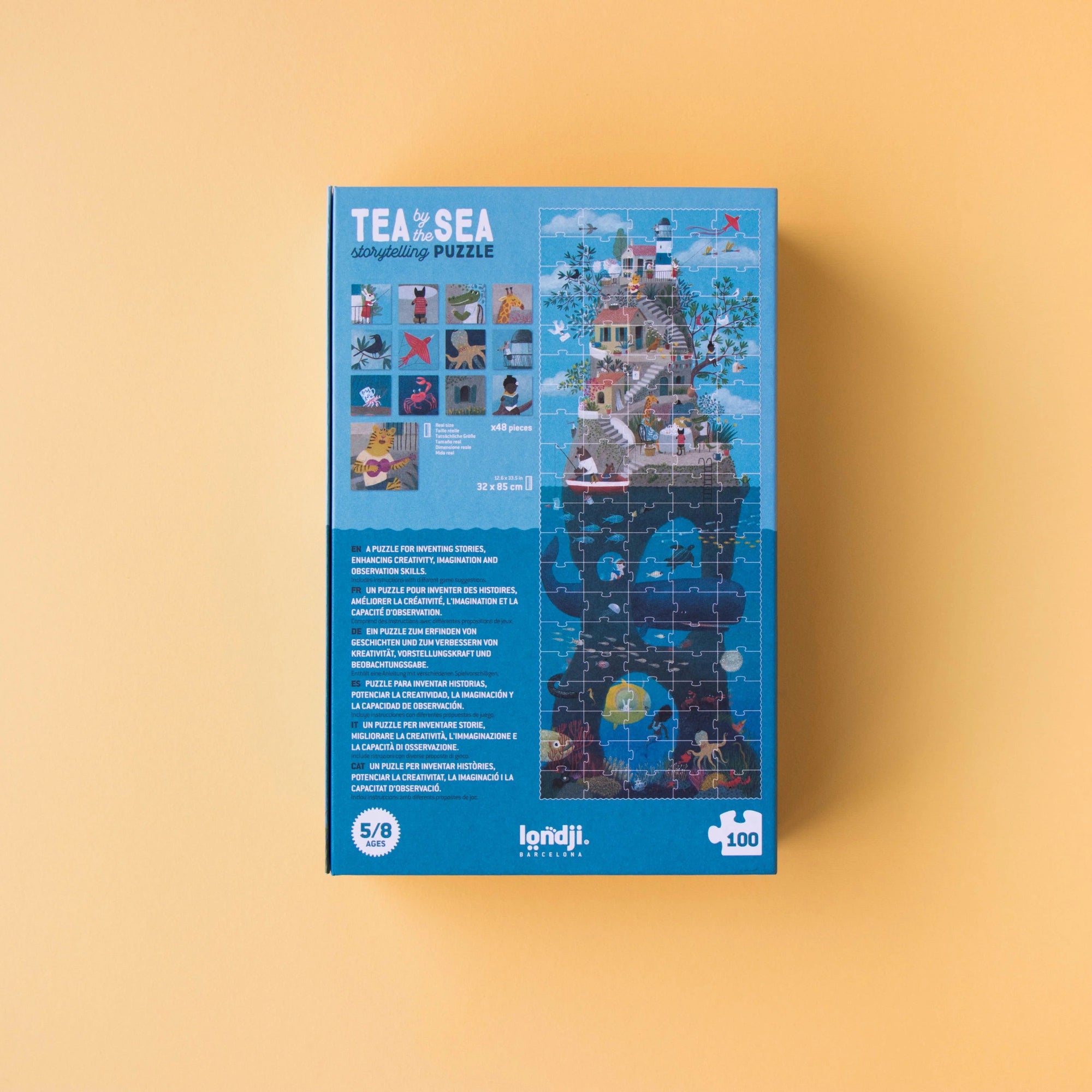 Jigsaw puzzle box with a blue design on a beige background