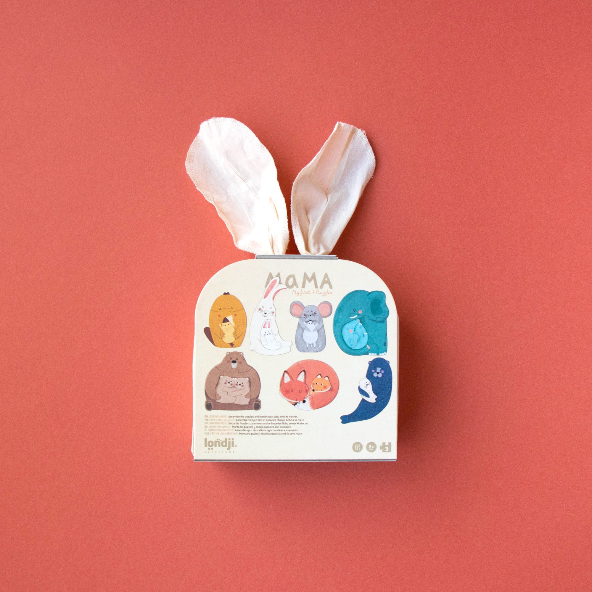 Tissue box with cartoon animal designs on a red background