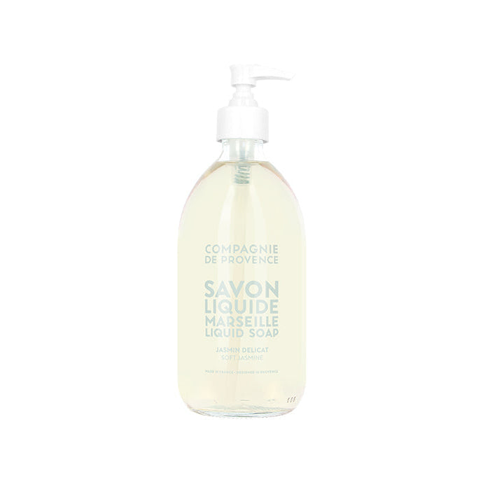 A clear glass pump bottle with 'Compagnie de Provence' and 'Savon Liquide Marseille' printed on the label, indicating a liquid hand soap product.