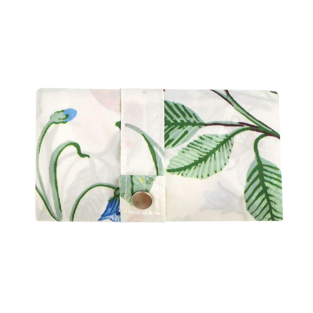 Floral patterned rolled up bag with green leaves and blue flowers on a white background