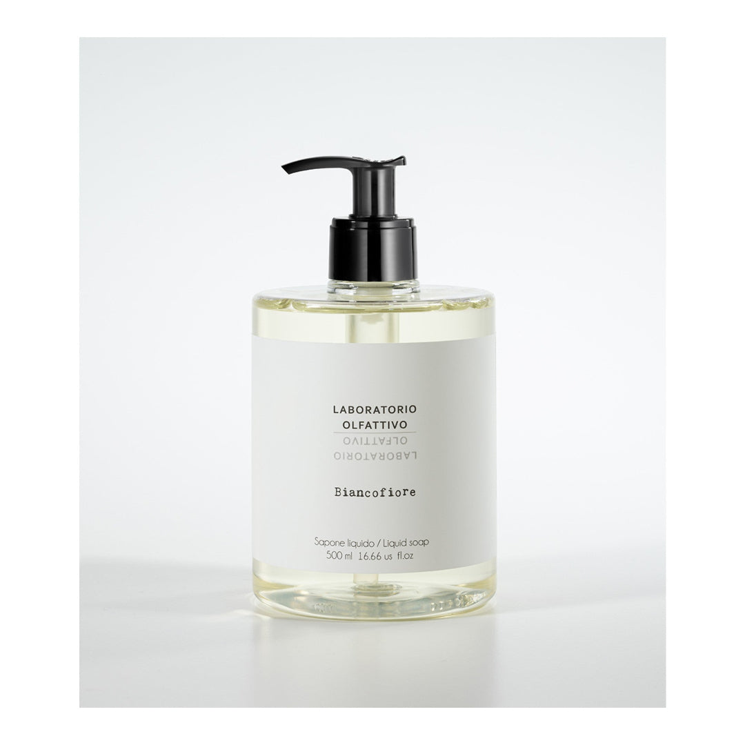 Hand soap bottle with pump on a white background