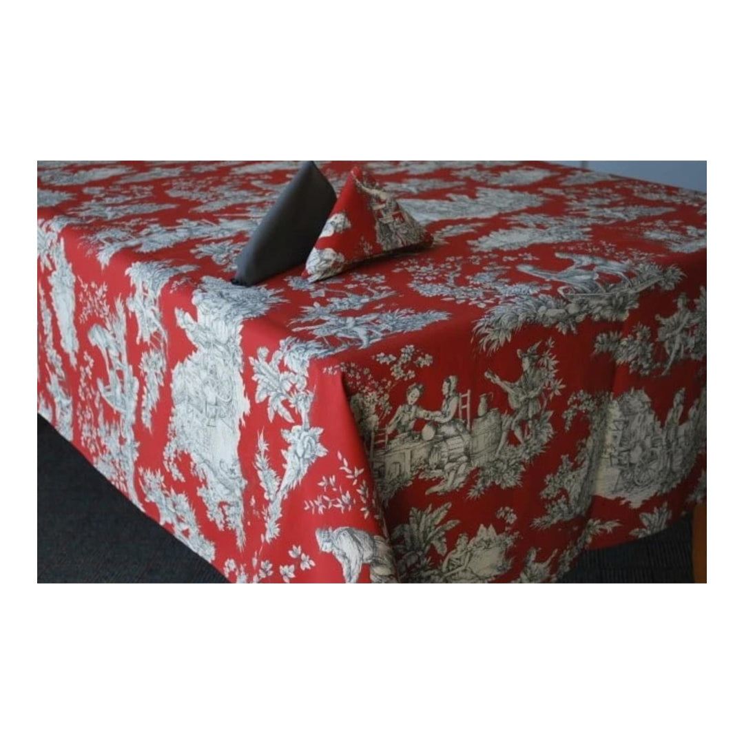 Red and white patterned tablecloth on a table with a white background
