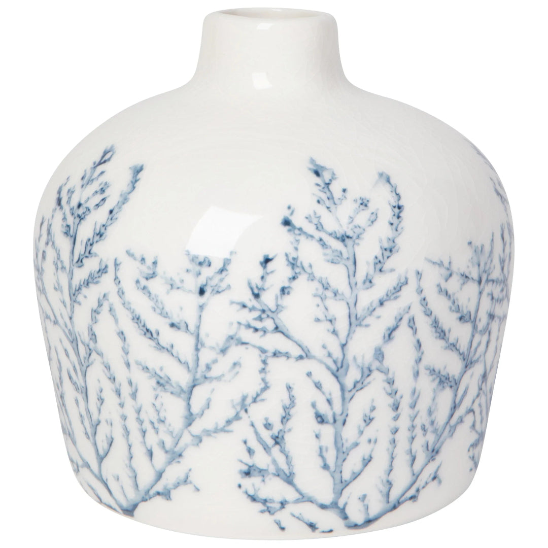 White vase with blue leaf patterns on a white background